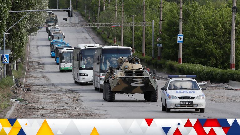 Buses carrying service members of Ukrainian forces who have surrendered after weeks holed up at Azovstal steel works drive away under escort of the pro-Russian military in the course of Ukraine-Russia conflict in Mariupol, Ukraine May 17, 2022. REUTERS/Alexander Ermochenko.