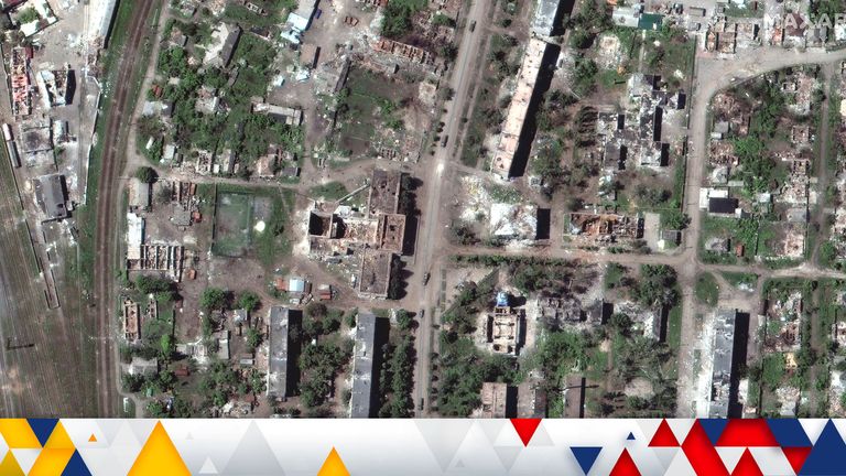 A satellite image shows destroyed buildings downtown and vehicles in convoy, amid Russia&#39;s invasion of Ukraine, in Popasna, Luhansk region, Ukraine May 25, 2022. Picture taken May 25, 2022. Satellite image 2022 Maxar Technologies/Handout via REUTERS ATTENTION EDITORS - THIS IMAGE HAS BEEN SUPPLIED BY A THIRD PARTY. MANDATORY CREDIT. NO RESALES. NO ARCHIVES. DO NOT OBSCURE LOGO. 