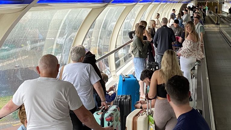Picture taken with permission from the twitter feed of @chrisjprice67 of people queuing at Manchester Airport, as Tui has announced a "small number" of flight cancellations and delays in a blow to travel plans at the start of the half-term break. Issue date: Monday May 30, 2022.
