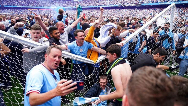 Manchester City fans stormed the pitch following the Premier League win