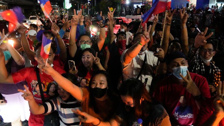 Supporters cheer as they arrive at the headquarters of Ferdinand ...Bongbong... Marcos, Jr. in Mandaluyong, Philippines on Monday, May 9, 2022. The son and namesake of ousted Philippine dictator Ferdinand Marcos took a commanding lead in an unofficial vote count in Monday...s presidential election in the deeply divided Asian democracy. (AP Photo/Aaron Favila)                         