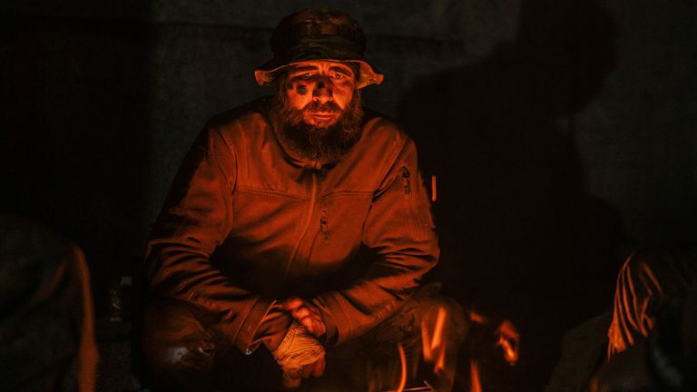 IIn this photo provided by Azov Special Forces Regiment of the Ukrainian National Guard Press Office, an Azov Special Forces Regiment&#39;s serviceman, injured during fighting against Russian forces, poses for a photographer inside the Azovstal steel plant in Mariupol, Ukraine, Tuesday, May 10, 2022. (Dmytro &#39;Orest&#39; Kozatskyi/Azov Special Forces Regiment of the Ukrainian National Guard Press Office via AP)