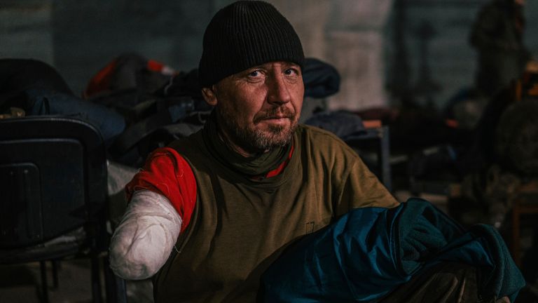 In this photo provided by the Azov Special Forces Regiment of the Ukrainian National Guard Press Office, a soldier of the Azov Special Forces Regiment, wounded while fighting against Russian forces, is taken photo for a photographer inside the Azovstal steel plant in Mariupol, Ukraine, Tuesday, May 10, 2022. (Special Forces Regiment Dmytro & # 39; Orest & # 39; Kozatskyi / Azov of Van Press Office of the National Guard of Ukraine via AP)