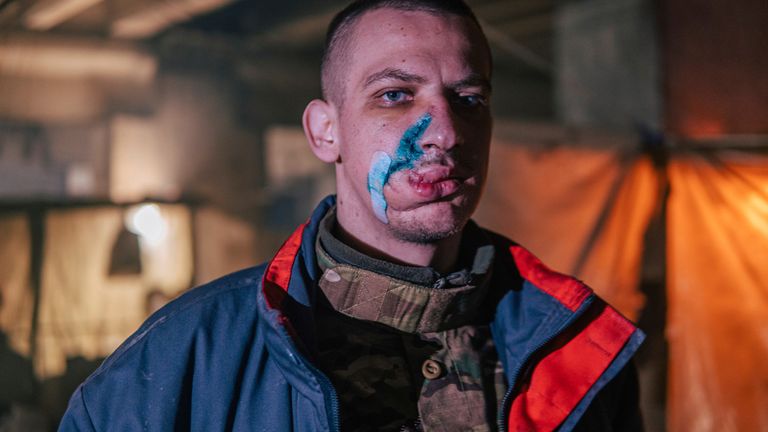 In this photo provided by Azov Special Forces Regiment of the Ukrainian National Guard Press Office, an Azov Special Forces Regiment&#39;s serviceman, injured during fighting against Russian forces, poses for a photographer inside the Azovstal steel plant in Mariupol, Ukraine, Tuesday, May 10, 2022. (Dmytro &#39;Orest&#39; Kozatskyi/Azov Special Forces Regiment of the Ukrainian National Guard Press Office via AP)