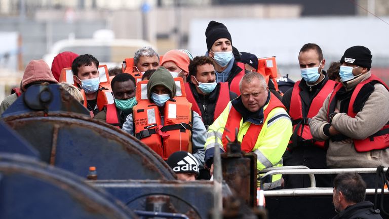 Migrants are escorted in Dover Harbour onboard a Border Force vessel after being rescued while crossing the English Channel, in Dover, Britain, May 1, 2022. REUTERS/Henry Nicholls
