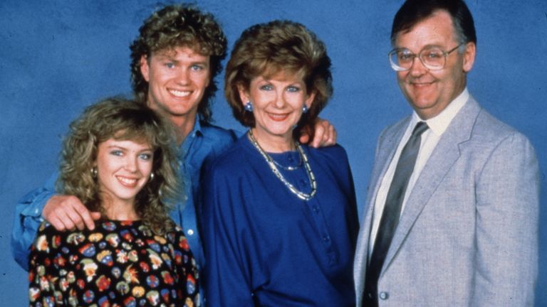 Kylie Minogue as Charlene Mitchell, Craig Mclachlan as Henry, Anne Charleston as Madge Bishop and Ian Smith as Harold Bishop in Neighbours