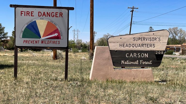 A sign shows extreme fire danger in the Carson National Forest which is near the Hermits Peak Calf Canyon Fire, in Taos, New Mexico, U.S., May 10, 2022. REUTERS/Andrew Hay
