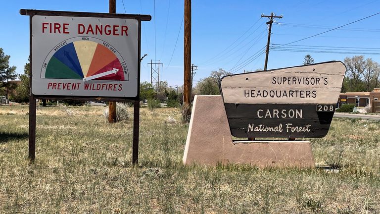 A sign shows extreme fire danger in the Carson National Forest which is near the Hermits Peak Calf Canyon Fire, in Taos, New Mexico, U.S., May 10, 2022. REUTERS/Andrew Hay
