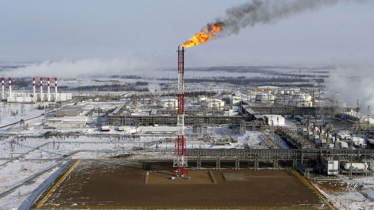FILE PHOTO: A flame burns from a tower at Vankorskoye oil field owned by Rosneft company north of the Russian Siberian city of Krasnoyarsk March 25, 2015. REUTERS/Sergei Karpukhin/File Photo
