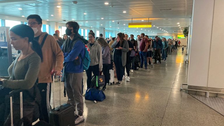 Passengers queue for flights at Heathrow Airport. Would-be travellers have labelled queues at Heathrow "bloody chaos" as the airport attempts to process passengers in time for their flights. Picture date: Tuesday May 31, 2022.
