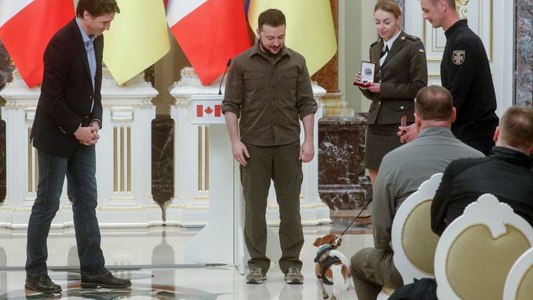 Canadian Prime Minister Justin Trudeau and his service dog present the award to Ukrainian President Volodymyr Zelenskiy "Patrons" during a press conference, as Russia's attack on Ukraine continues, in Kyiv, Ukraine May 8, 2022. REUTERS/Valentyn Ogirenko TPX PICTURE OF THE DAY