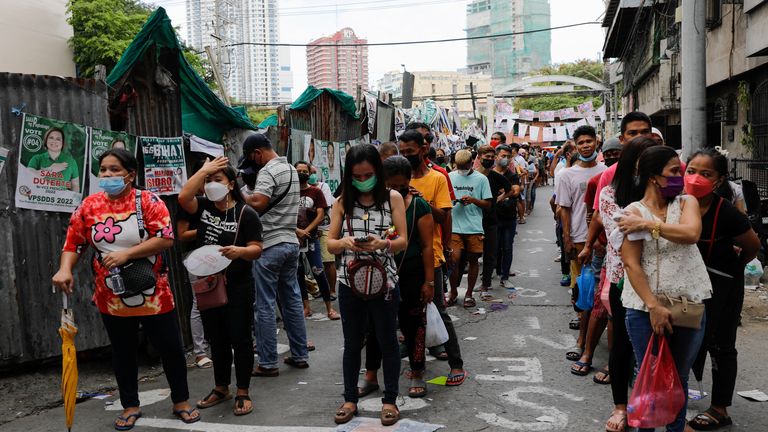 People queue outside a polling station Tondo, Metro Manila, Philippines