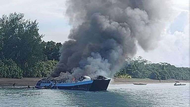 The Philippine Coast Guard released images of the ship engulfed in flames, off the port of Real, Quezon province