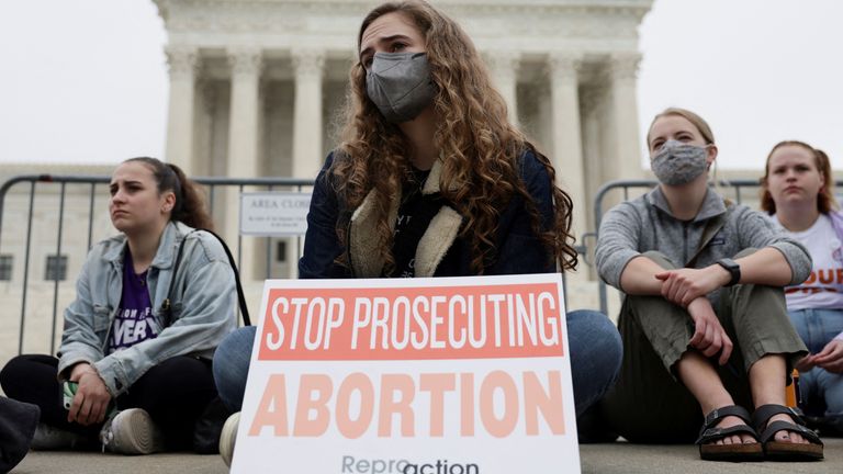 Protestors sit outside the U.S. Supreme Court after the leak of a draft majority opinion written by Justice Samuel Alito preparing for a majority of the court to overturn the landmark Roe v. Wade abortion rights decision later this year, in Washington, U.S., May 3, 2022. REUTERS/Evelyn Hockstein
