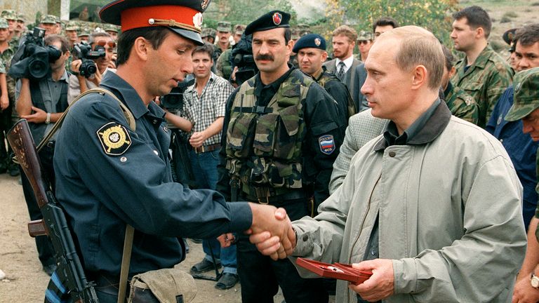 Vladimir Putin built his reputation in Russia on his crackdown on Chechen rebels. Here he presents and award to a Russian police officer in the region in 1997, weeks after becoming PM. Pic: AP