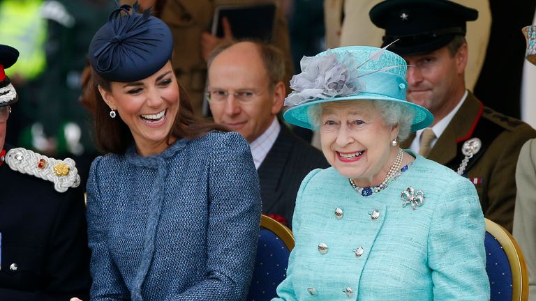 Britain&#39;s Catherine, Duchess of Cambridge (L) laughs as Queen Elizabeth gestures while they watch part of a children&#39;s sports event during a visit to Vernon Park in Nottingham, central England, June 13, 2012. REUTERS/Phil Noble (BRITAIN - Tags: ENTERTAINMENT SOCIETY ROYALS)
