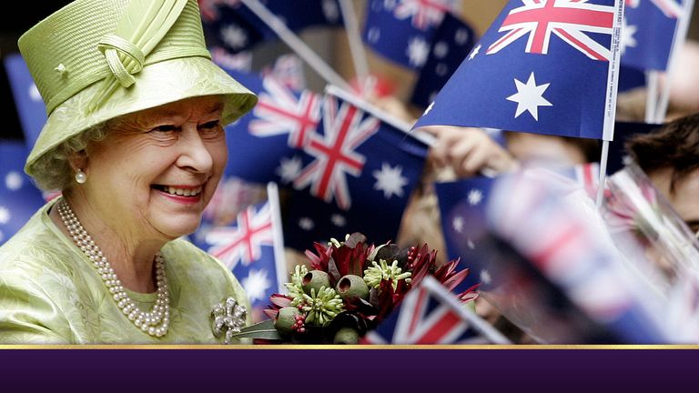 Britain&#39;s Queen Elizabeth ll,  left, receives flowers from waiting school childrenwith waiving national flags after the Commonwealth Day Service in Sydney,  Australia, Monday, March 13, 2006. The Queen will open the melbourne Commonwealth Games on March 15, 2006. (AP Photo/Rob Griffith, Pool)
PIC:AP