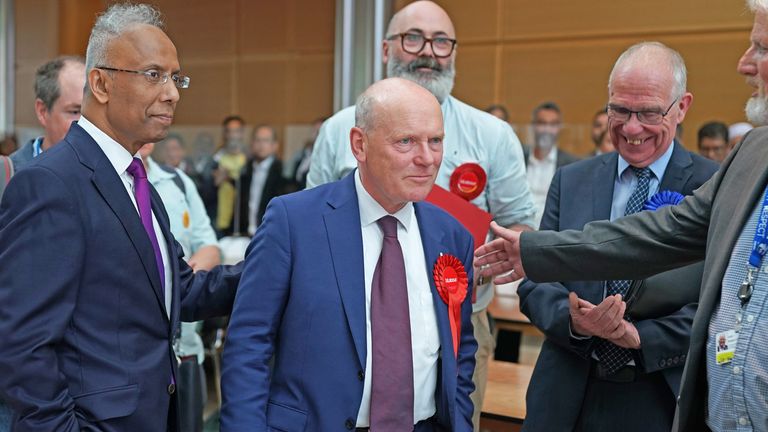 Lutfur Rahman (left) who has been elected mayor of Tower Hamlets in London on the second round, defeating incumbent John Biggs (centre) of Labour, at the Tower Hamlets election count in London. Picture date: Friday May 6, 2022.