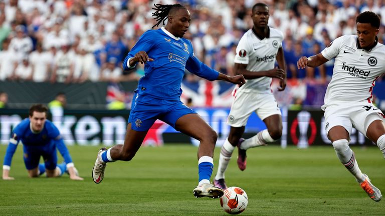 Rangers&#39; Joe Aribo, left, tries to control a ball during the Europa League final soccer match between Eintracht Frankfurt and Rangers FC at the Ramon Sanchez Pizjuan stadium in Seville, Spain, Wednesday, May 18, 2022. (AP Photo/Pablo Garcia)
