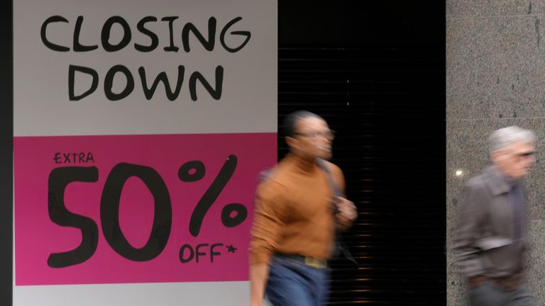 Shoppers pass a closing down shop in Oxford Street in London, Wednesday, April 13, 2022. British consumer prices rose at their fastest pace in 30 years last month, fueled by soaring prices for household energy and motor fuels. The Office of National Statistics reported on Wednesday that inflation accelerated to 7% in the 12 months through March. (AP Photo/Kirsty Wigglesworth)                                                                                                                                                                                              