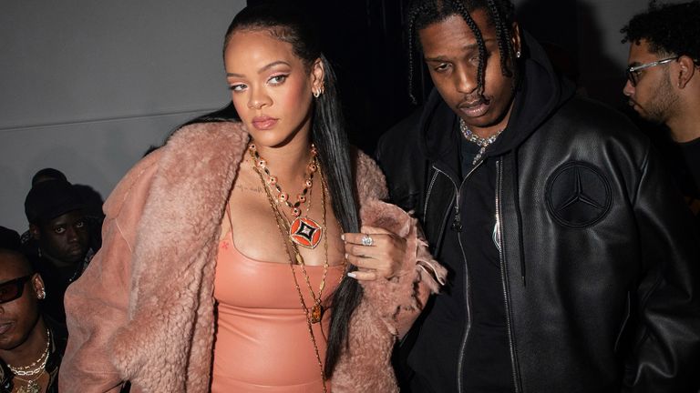 Rihanna, left, and ASAP Rocky arrive for the Off-White Ready To Wear Fall/Winter 2022-2023 fashion collection, unveiled during the Fashion Week in Paris, Monday, Feb. 28, 2022. (Photo by Vianney Le Caer/Invision/AP)