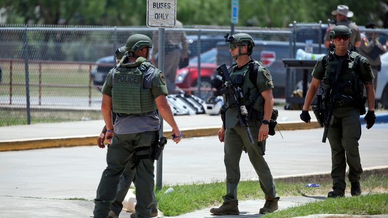 Police stand outside the Robb Elementary school in Uvalde, Texas Tuesday, May 24, 2022.  A Texas hospital says two people have died after a shooting at an elementary school in Uvalde. Uvalde Memorial Hospital says it received 13 children via ambulance or bus for treatment after an active shooter was reported at Robb Elementary School in Uvalde, about 85 miles west of San Antonio.(AP Photo/Dario Lopez-Mills)..
PIC:AP