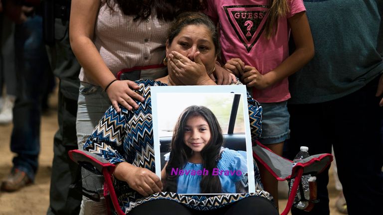 Esmeralda Bravo, 63, cries as she holds a photo of her granddaughter, Nevaeh, one of the victims of the Robb Elementary School shooting, during a prayer vigil in Uvalde, Texas, May 25, 2022. killed 19 schoolchildren and two teachers, described a year-end holiday that quickly turned to terror.  (AP Photo / Jae C. Hong, File)