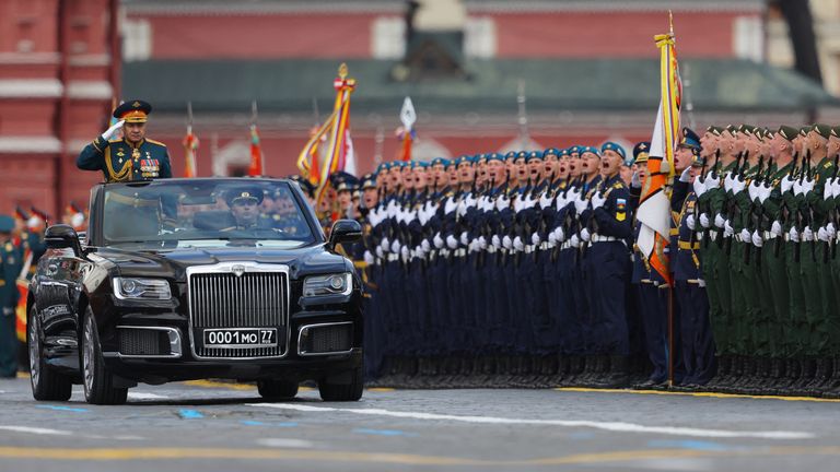 Russian Defence Minister Sergei Shoigu drives an Aurus cabriolet during a military parade on Victory Day, which marks the 77th anniversary of the victory over Nazi Germany in World War Two, in Red Square in central Moscow, Russia May 9, 2022. REUTERS/Evgenia Novozhenina