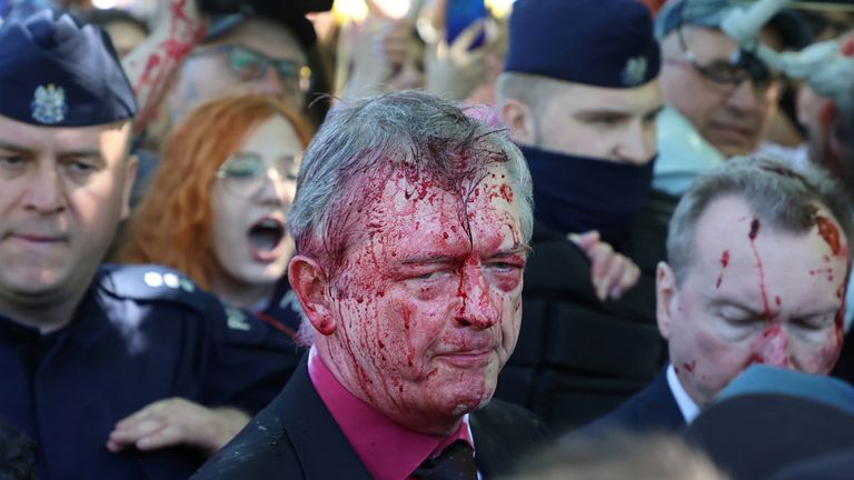 Russia&#39;s ambassador to Poland Sergey Andreev is covered in red substance thrown by protesters as he came to celebrate Victory day at the Soviet Military Cemetery to mark the 77th anniversary of the victory over Nazi Germany, in Warsaw, Poland May 9, 2022. Slawomir Kaminski/Agencja Wyborcza.pl via REUTERS ATTENTION EDITORS - THIS IMAGE WAS PROVIDED BY A THIRD PARTY. POLAND OUT. NO COMMERCIAL OR EDITORIAL SALES IN POLAND. TPX IMAGES OF THE DAY
