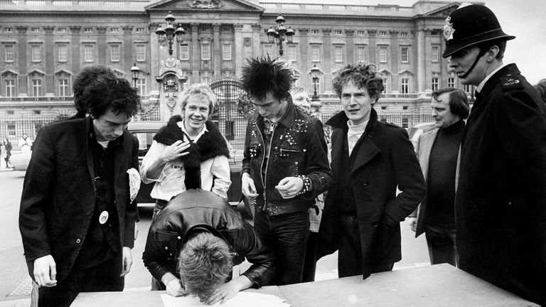 The Sex Pistols, signing a new recording contract with A&M Records outside Buckingham Palace in 1977