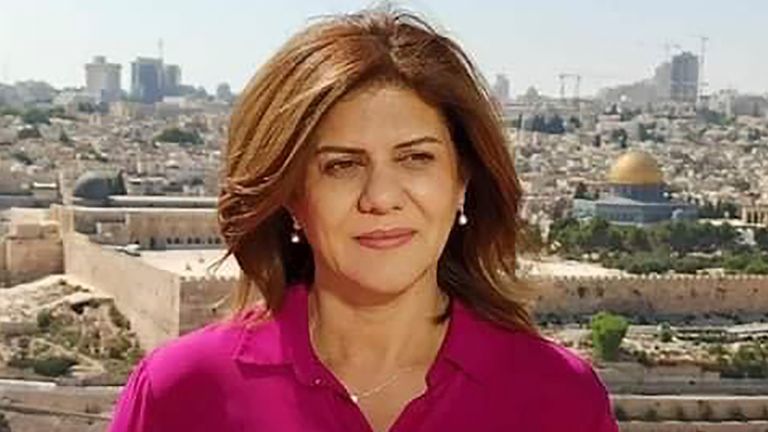 In this undated photo provided by Al Jazeera, Shireen Abu Akleh, a reporter for the Al Jazeera Network, stands in an area where the Dome of the Rock shrine of Al-Aqsa Mosque in Jerusalem's Old City is seen at right in background.  Abu Akleh, a well-known Palestinian journalist with the broadcaster's Arabic-language channel, was shot and killed while covering an Israeli raid in the occupied West Bank city of Jenin early on Wednesday, May 11, 2022. (Al Jazeera via PA )