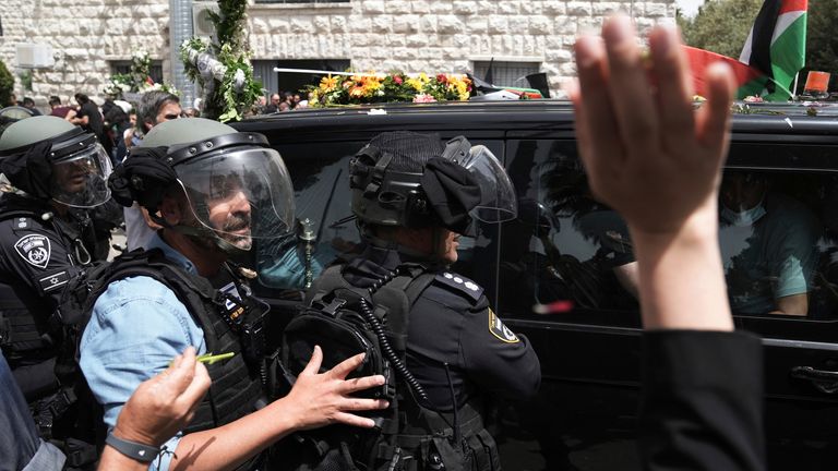 Israeli police in riot gear surround the vehicle carrying the coffin of Al Jazeera veteran journalist Shireen Abu Akleh. Pic: AP