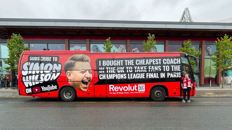 Liverpool supporter Simon Wilson with his coach that transported dozens of fellow fans to Paris for just £1 each ahead of the Champions League final