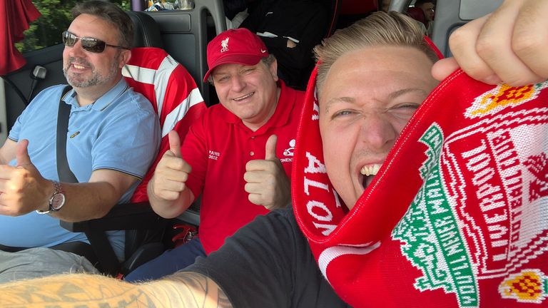 Liverpool supporter Simon Wilson (right) with his coach that transported dozens of fellow fans to Paris for just £1 each ahead of the Champions League final