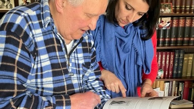 91-year-old Seppo Koivupuri, who as a child witnessed the winter war 1939/40 between the Soviet Union and Finland, scrolls through a photo book with correspondent Siobhan Robbins in Lappeenranta, Finland ; 14 May 2022