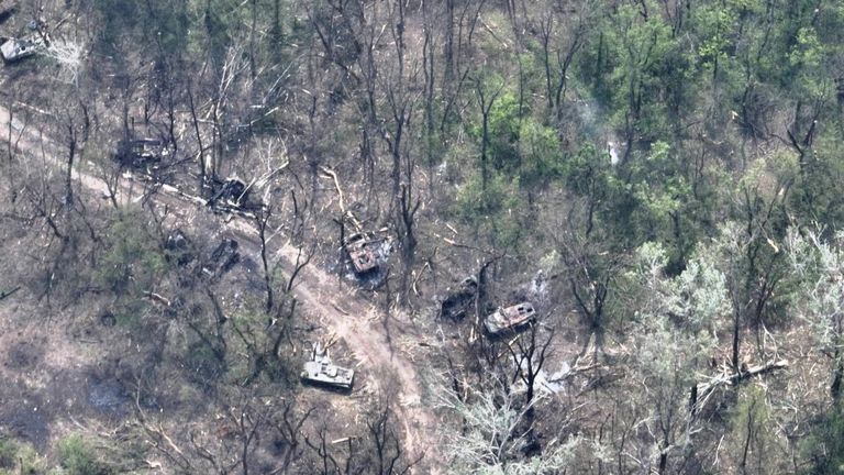 An aerial view of burnt vehicles on the banks of Siverskyi Donets River, eastern Ukraine, in this handout image uploaded on May 12, 2022. Ukrainian Airborne Forces Command/Handout via REUTERS THIS IMAGE HAS BEEN SUPPLIED BY A THIRD PARTY.
