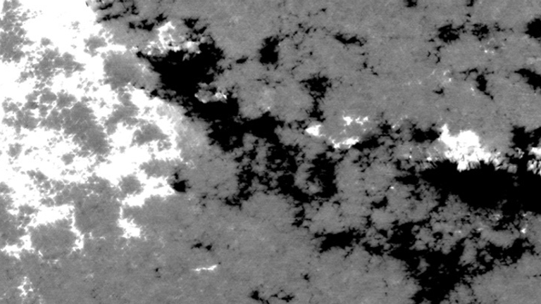 Positive and negative charged parts of the Sun&#39;s surface, denoted by black and white. Pic: ESA