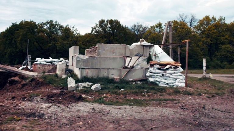 Damaged buildings and destroyed Russian vehicles litter the terrain in Staryi Saltiv