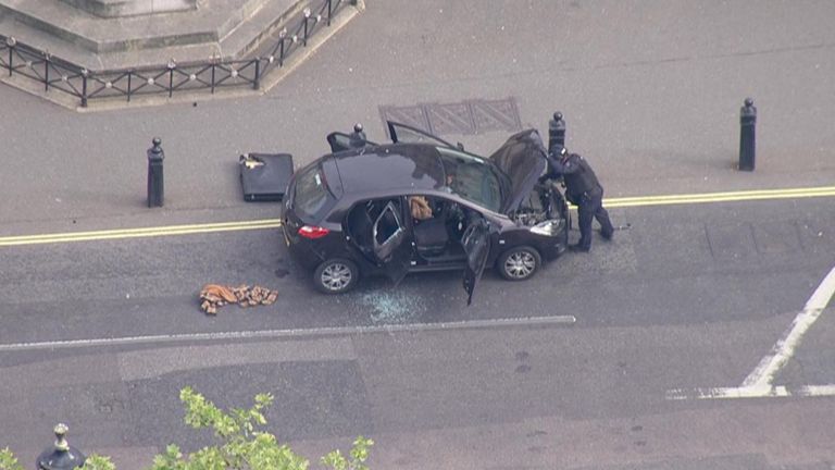 Police officers set up a cordon and closed roads near Parliament Square