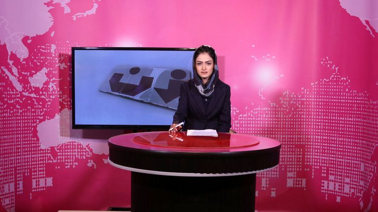 FILE - Basira Joya, 20, presenter of the news program sits during recording at the Zan TV station (women&#39;s TV) in Kabul, Afghanistan, May 30, 2017. Afghanistan&#39;s Taliban rulers ordered all female presenters on TV channels to cover their faces on air, the country&#39;s biggest media outlet said Thursday, May 19, 2022. (AP Photo/Rahmat Gul, File)