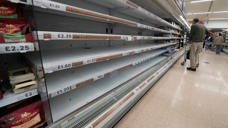 A view of empty shelves at a Tesco supermarket in Manchester, England, Sunday, Sept 12, 2021. Retailers, manufacturers and food suppliers have also reported disruptions due to a shortage of truck drivers linked to the pandemic and Britain’s departure from the European Union, which has made it harder for many Europeans to work in the U.K. (AP Photo/Jon Super)