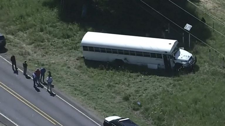 Authorities investigate the area where the bus ran off the road, which lead to the prisoner stabbing an officer and escaping. KPRC-TV.