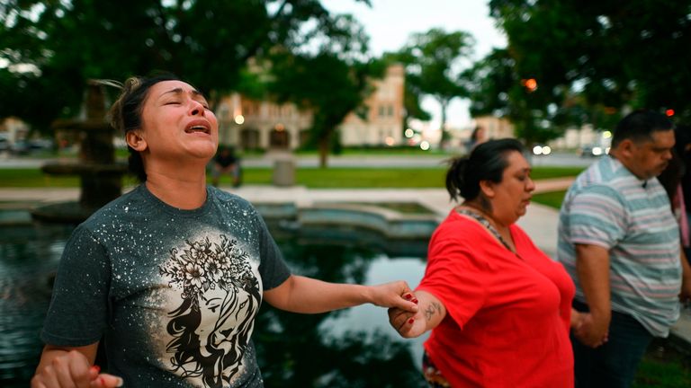 Kladys Castell..n prays during a vigil for the 18 children and three adults that died at a mass shooting at Robb Elementary School in Uvalde on Tuesday, May 24, 2022.