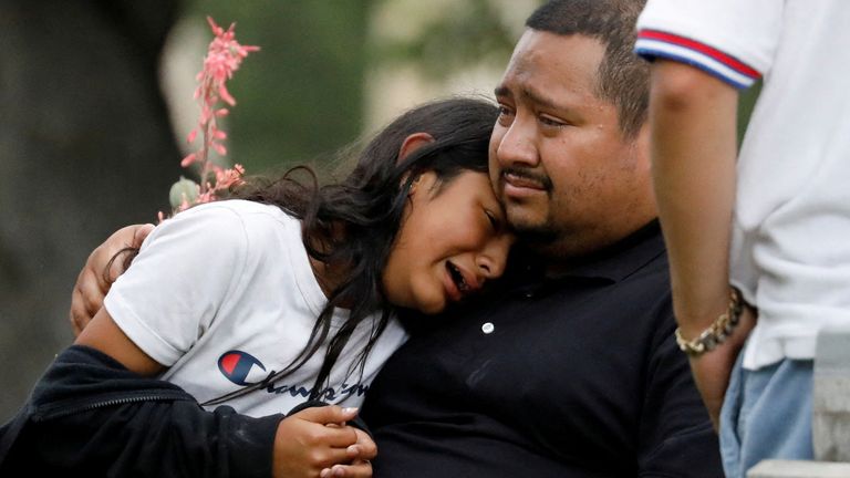 People react outside the Ssgt Willie de Leon Civic Center, where students had been transported from Robb Elementary School after a shooting, in Uvalde, Texas, U.S. May 24, 2022.