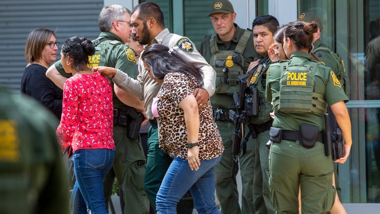 People leave the Uvalde Civic Center where students from the school were evacuated to after the shooting. Pic: AP