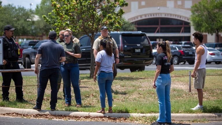 A law enforcement officer told people Tuesday afternoon, May 24, 2022, that Uvalde High School is safe after a school shooting near Robb Elementary School in Uvalde, Texas.