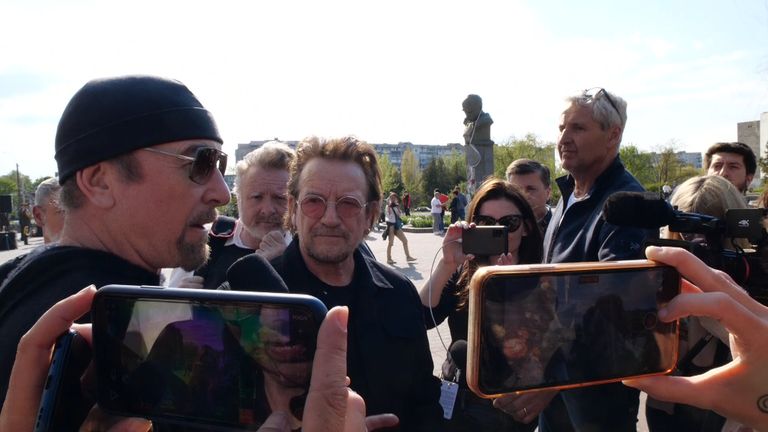 U2&#39;s The Edge speak to reporters in Borodyanka, as bandmate Bono and Sky News&#39;s Mart Austin look on