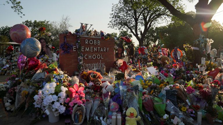Flowers, toys, and other objects to remember the victims of the deadliest U.S. school shooting in nearly a decade resulting in the death of 19 children and two teachers, are seen at a memorial at Robb Elementary School in Uvalde, Texas, U.S. May 30, 2022. Picture taken May 30, 2022. REUTERS/Veronica G. Cardenas