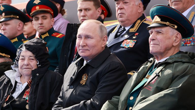 Russian President Vladimir Putin watches a military parade on Victory Day, the 77th anniversary of the victory over Nazi Germany in World War II, at Red Square in central Moscow, Russia May 9, 2022. Sputnik / Mikhail Metzel / Pool via REUTERS ATTENTION EDITOR - THIS IMAGE IS SUPPLYED BY THIRD PARTY.