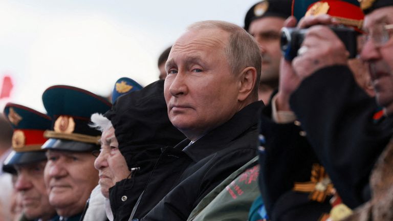 Vladimir Putin watches the military parade on Victory Day